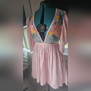 leobella mini dress with sheer front and flower appliques.